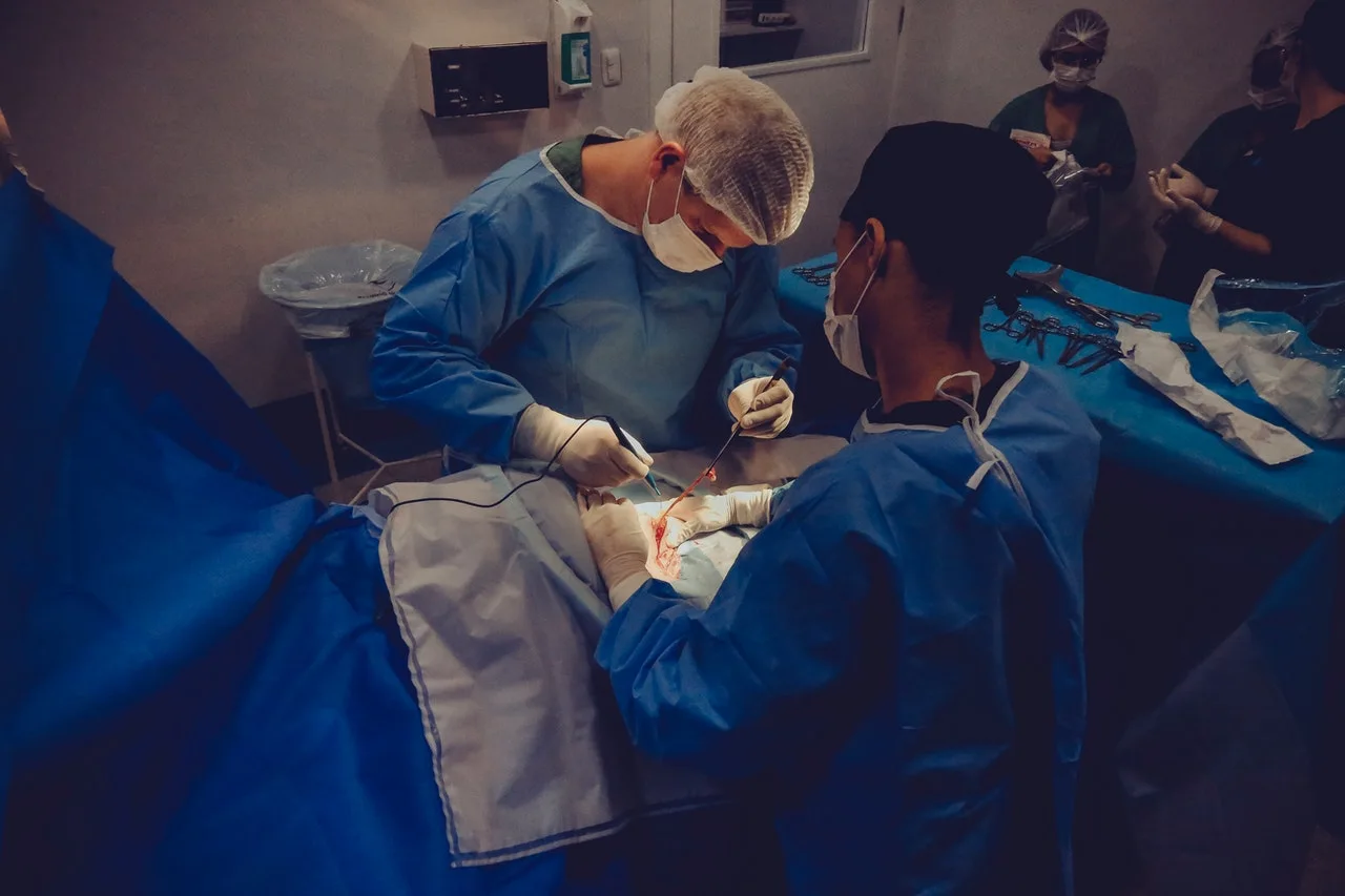Men operating a surgery