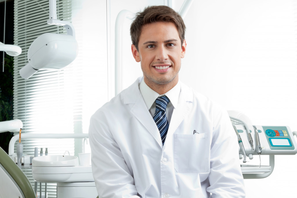 dentist sitting inside a dental clinic