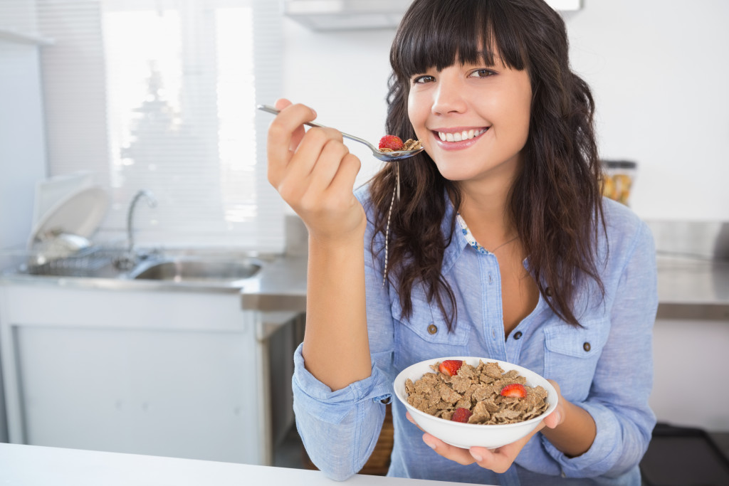 woman eating cereal