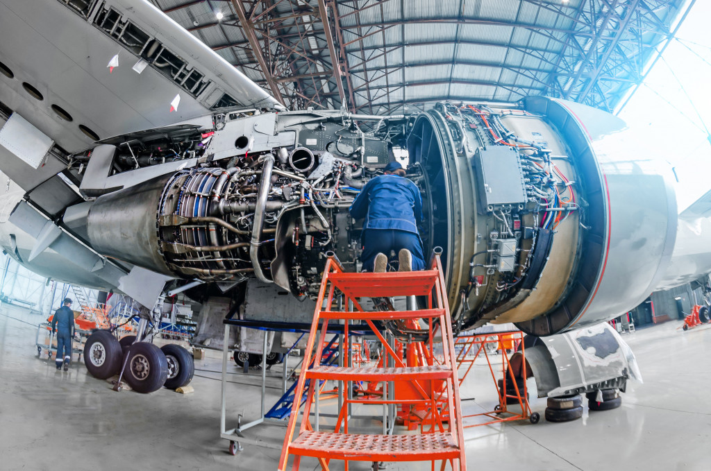 someone checking the airplane's engines