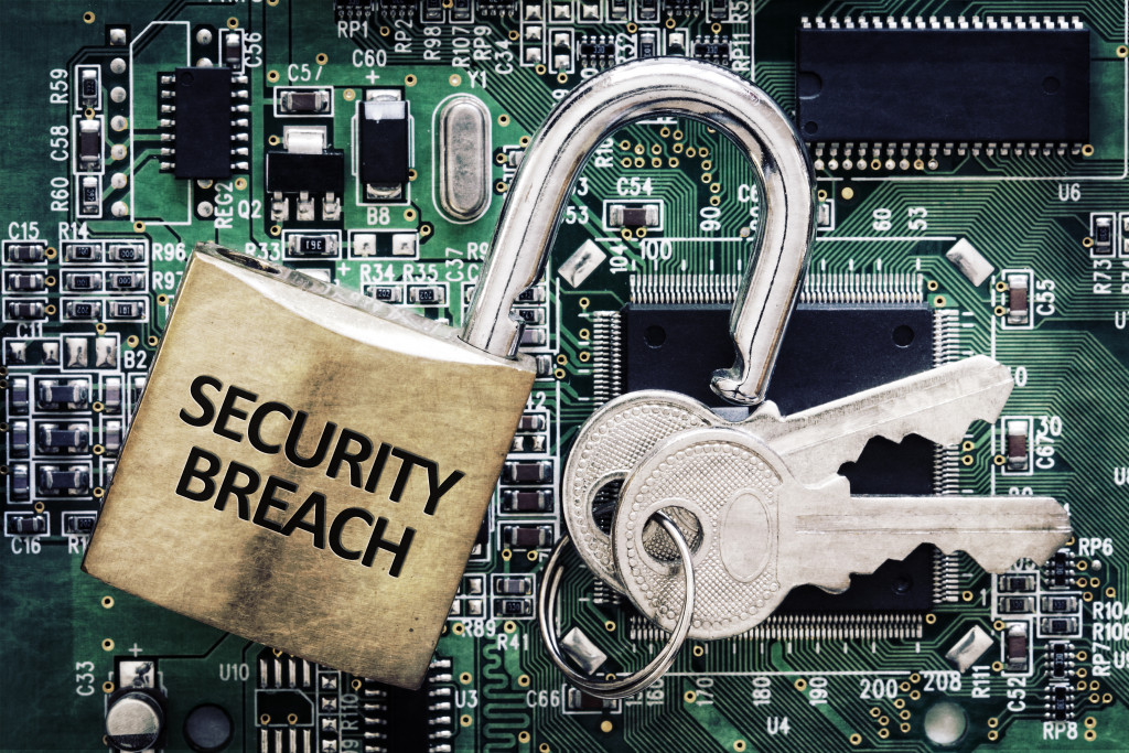 A padlock saying security breach, on the background is a chipset