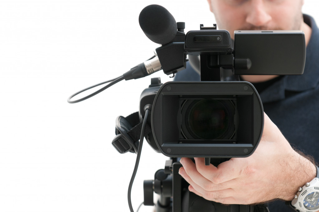 A cameraman creating videos for business marketing