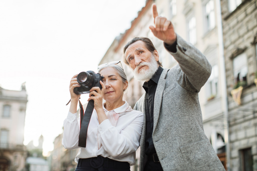 elderly couple with a vintage camera