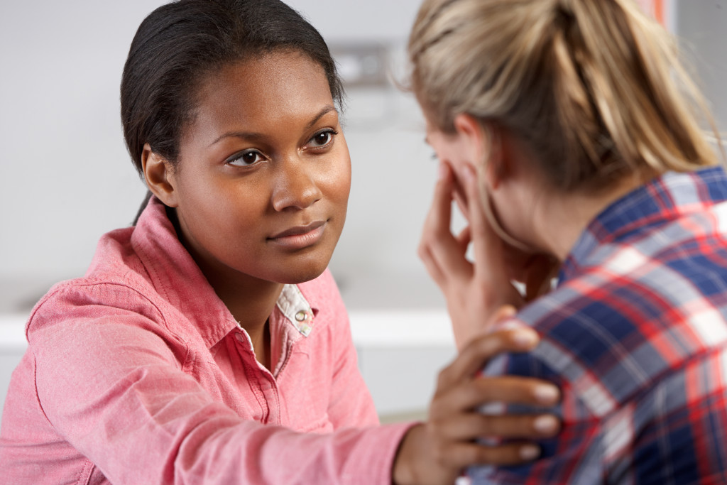 Teenage Girl Visits Doctor's Office Suffering With Depression