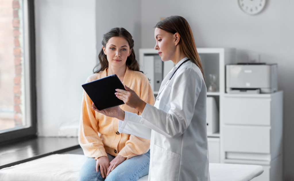 A patient consulting a doctor regarding her illness