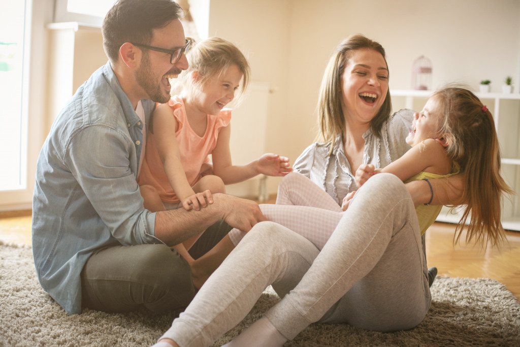 parents playing with their young daughters