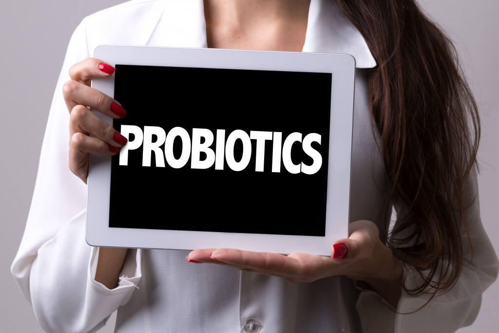 Female doctor holding a tablet with the text: Probiotics