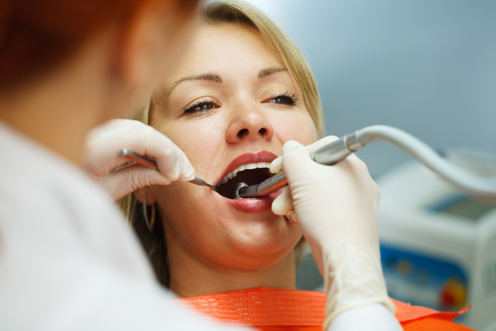 woman having her teeth checked in a dental clinic