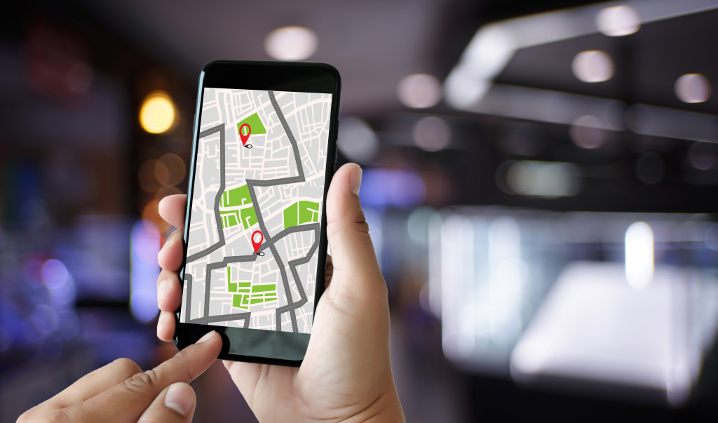 person using phone's gps app to track navigation
