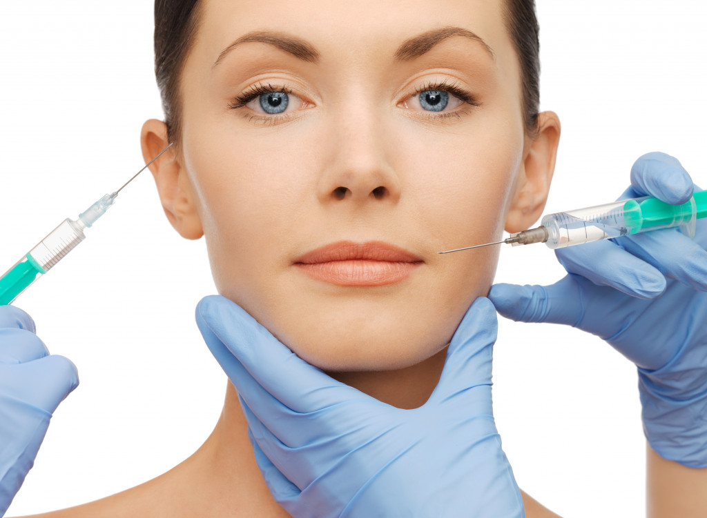 woman getting dermal fillers injection