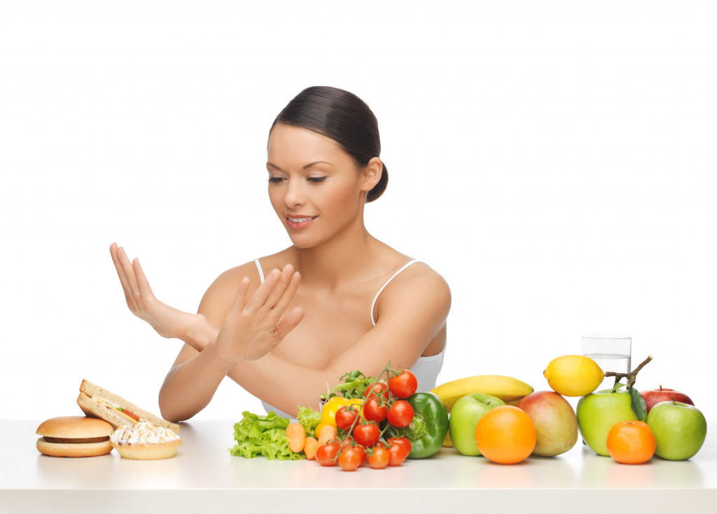 woman saying to no unhealthy food