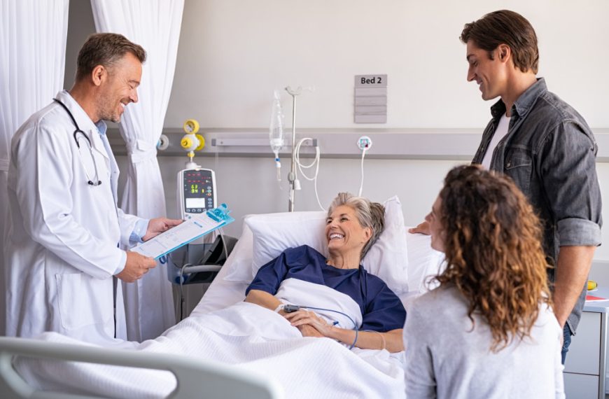 a doctor delivering good news to his patient to her patient's family