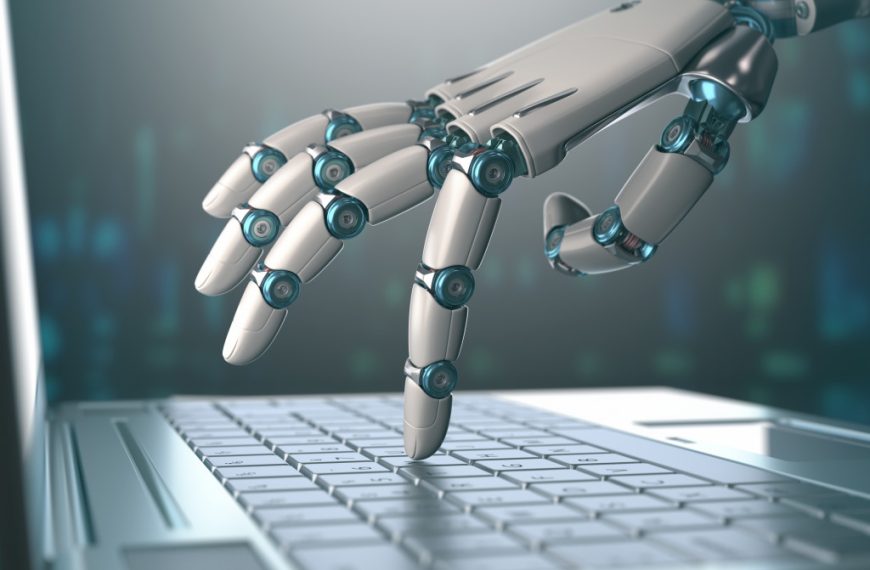 robot hand on laptop keyboard